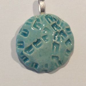 Aromatherapy clay fired pendant